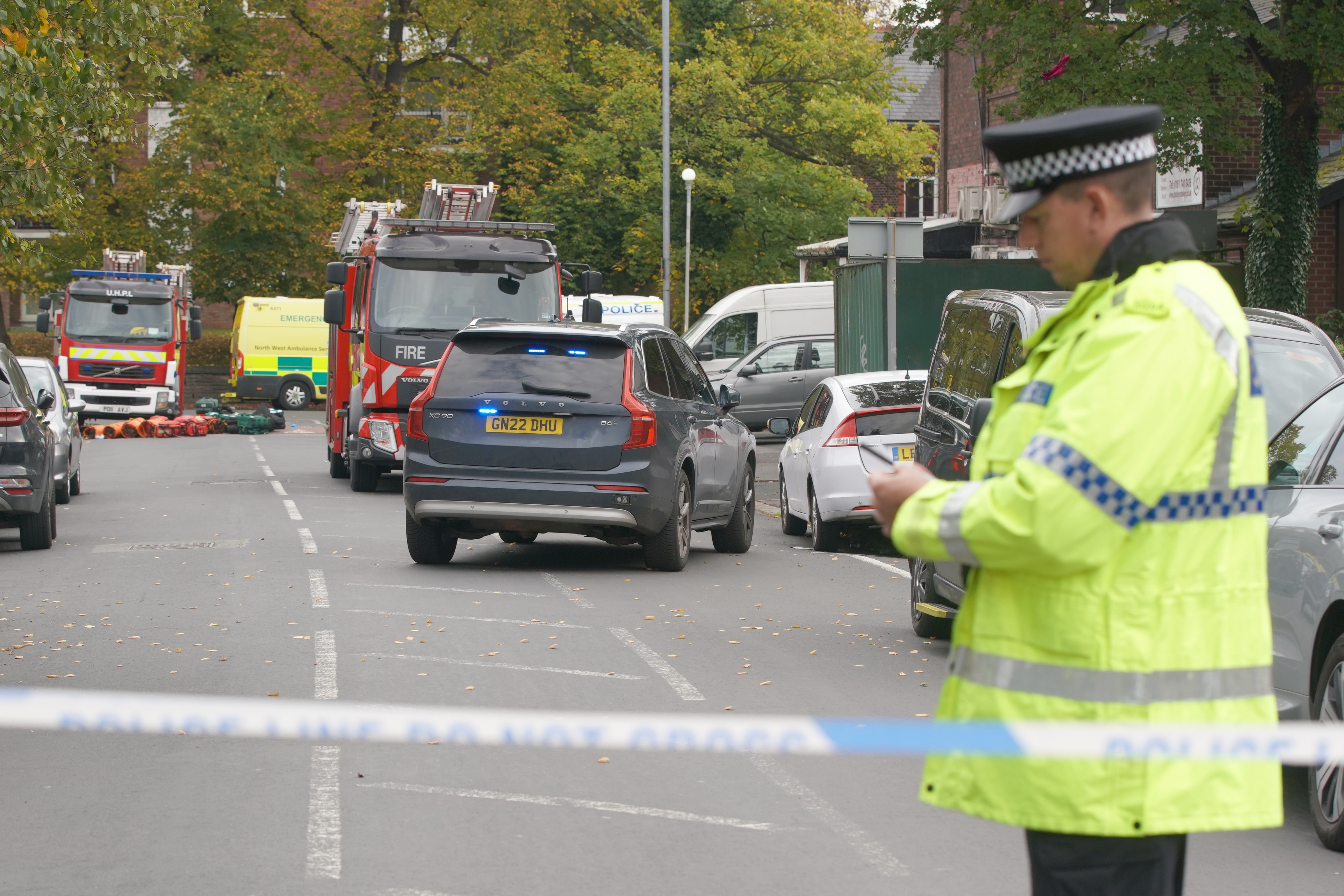 Police guard a cordon at the scene of a stabbing incident at Heaton Park Hebrew Congregation synagogue, in Crumpsall, Manchester, England, Thursday, Oct. 2, 2025.